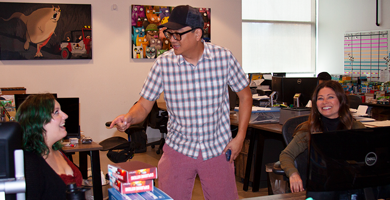 Coworkers chatting in an office