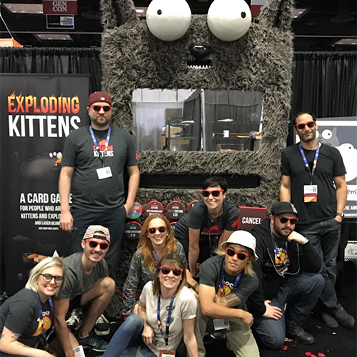 Exploding Kittens team photo at a convention booth, 2016 