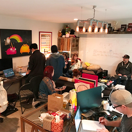 Exploding Kittens team working among shipping boxes, 2017 