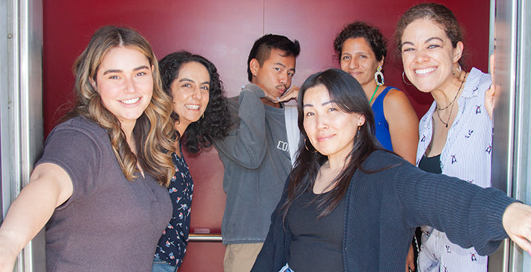 Group selfie of smiling coworkers 
