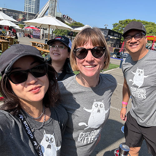 Three people taking a selfie at an outdoor event 