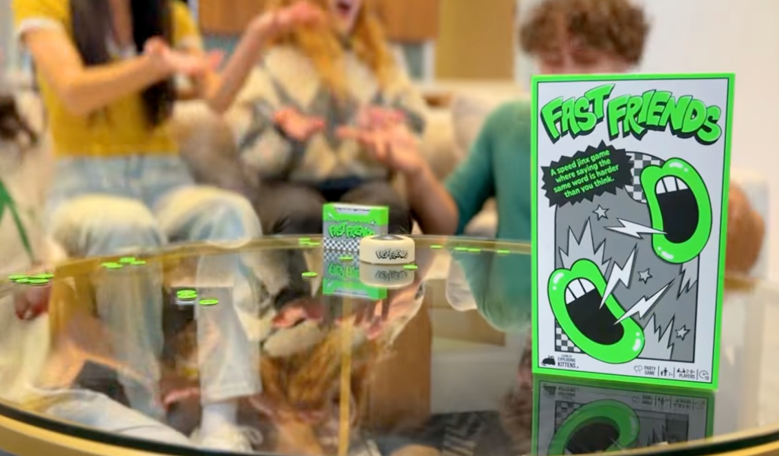 Person showing a game product in a video 
